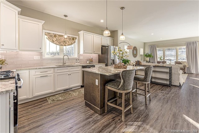 2 Lombard Cir Unit 2, North Haven, CT 06473 - kitchen featuring stainless steel appliances, open floor plan, healthy amount of natural light, white cabinets, and recessed lighting
