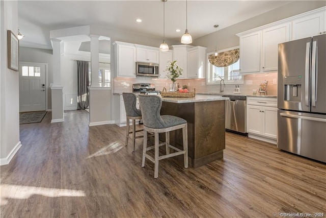 2 Lombard Cir Unit 2, North Haven, CT 06473 - kitchen with stainless steel appliances, a center island, healthy amount of natural light, backsplash, and recessed lighting