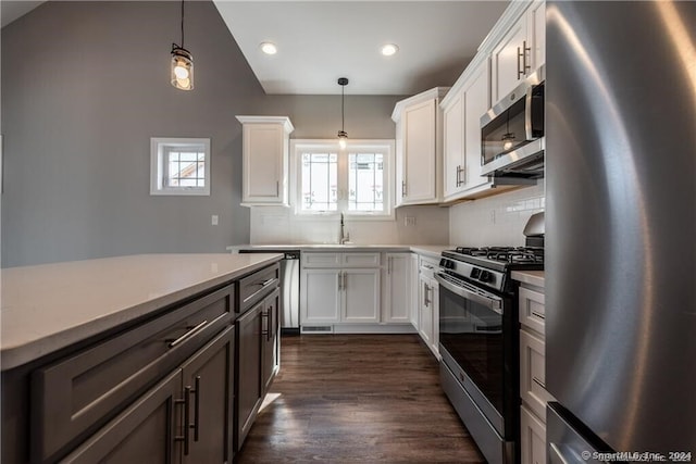 4 Lombard Cir Unit 4, North Haven, CT 06473 - kitchen featuring appliances with stainless steel finishes, backsplash, light countertops, recessed lighting, and pendant lighting