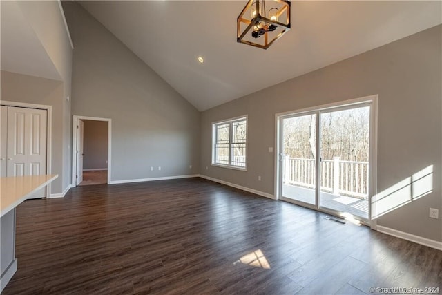 4 Lombard Cir Unit 4, North Haven, CT 06473 - unfurnished living room featuring a chandelier, dark wood-type flooring, and high vaulted ceiling