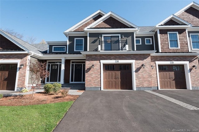 120 Yorkshire Ct Unit 120, Farmington, CT 06032 - craftsman inspired home with driveway, an attached garage, brick siding, and a balcony