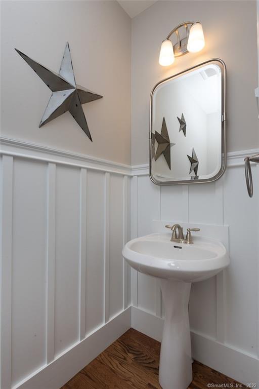 120 Yorkshire Ct Unit 120, Farmington, CT 06032 - bathroom with a decorative wall, a wainscoted wall, and wood finished floors
