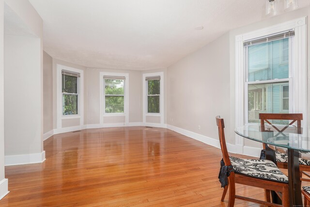 48 Livingston St, New Haven, CT 06511 - unfurnished dining area with light wood finished floors and baseboards