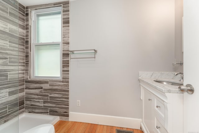 48 Livingston St, New Haven, CT 06511 - full bath featuring vanity, tiled shower, and wood finished floors