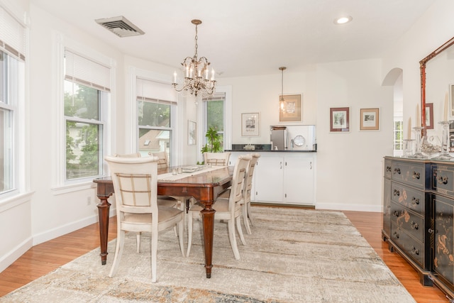 48 Livingston St, New Haven, CT 06511 - dining space with arched walkways, light wood-style flooring, a chandelier, healthy amount of natural light, and recessed lighting