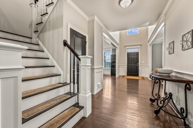 35 Bridgehampton Xing, Farmington, CT 06085 - foyer entrance featuring stairs, dark wood finished floors, wainscoting, and a decorative wall
