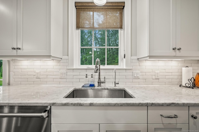 35 Bridgehampton Xing, Farmington, CT 06085 - kitchen featuring stainless steel dishwasher, white cabinets, decorative backsplash, and light stone counters
