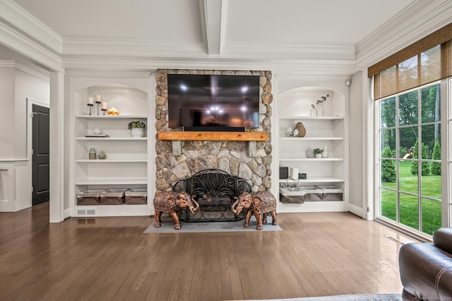 35 Bridgehampton Xing, Farmington, CT 06085 - living room featuring built in shelves, crown molding, plenty of natural light, and wood finished floors
