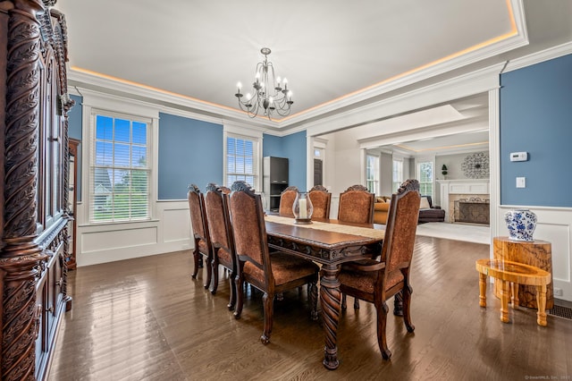35 Bridgehampton Xing, Farmington, CT 06085 - dining area with a chandelier, a decorative wall, ornamental molding, wainscoting, and a fireplace