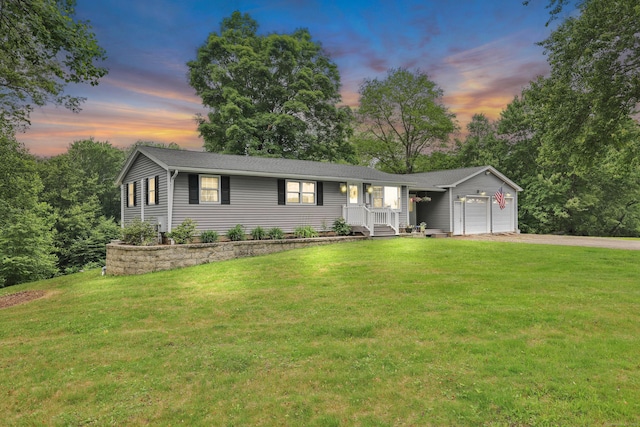 1117 N Grand St, Suffield, CT 06093 - single story home with a garage, driveway, a front yard, and covered porch
