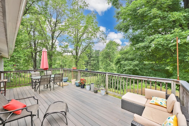 1117 N Grand St, Suffield, CT 06093 - wooden deck featuring outdoor dining space and view of wooded area