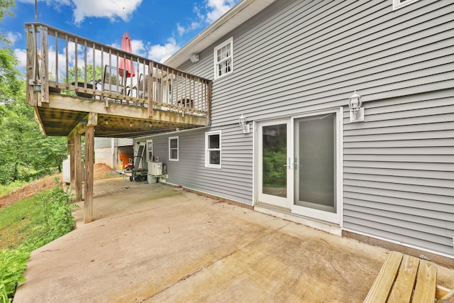1117 N Grand St, Suffield, CT 06093 - rear view of property with a patio area and a wooden deck