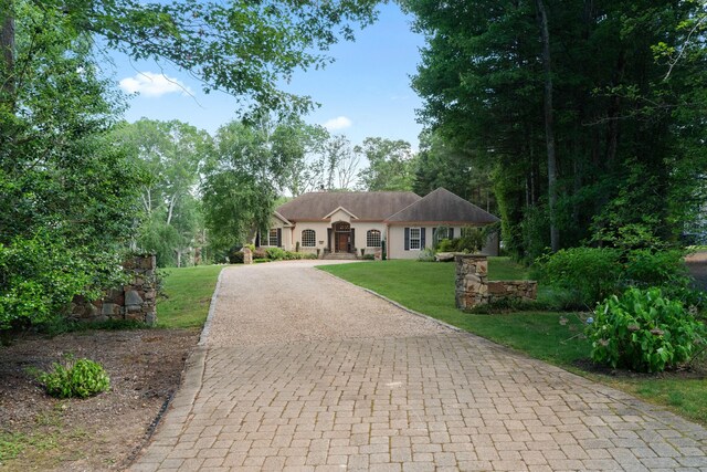45 Shaker Ct, Guilford, CT 06437 - ranch-style house with decorative driveway, a front lawn, and stucco siding