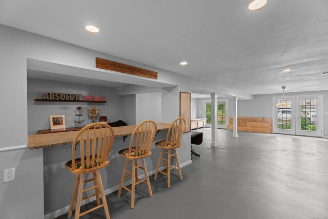 45 Shaker Ct, Guilford, CT 06437 - indoor dry bar with recessed lighting, ornate columns, and concrete floors