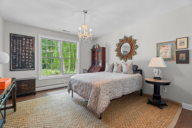 45 Shaker Ct, Guilford, CT 06437 - bedroom featuring a baseboard radiator, a chandelier, and wood finished floors