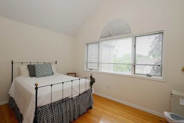 73 Harbour View Pl Unit 73, Stratford, CT 06615 - bedroom with light wood-type flooring and lofted ceiling