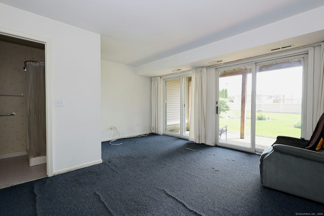 73 Harbour View Pl Unit 73, Stratford, CT 06615 - unfurnished living room featuring carpet flooring and baseboards