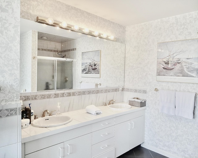 73 Harbour View Pl Unit 73, Stratford, CT 06615 - bathroom featuring wallpapered walls, a shower stall, double vanity, and tile patterned flooring