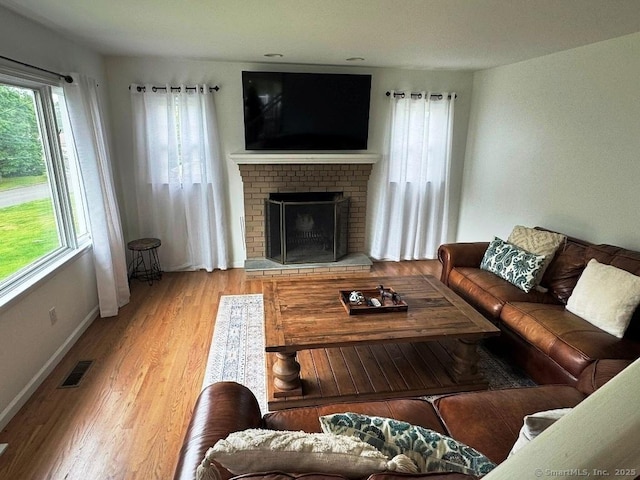 8 Breezy Knoll Ave, Wolcott, CT 06716 - living area featuring wood finished floors and a fireplace