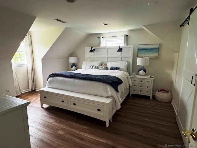 8 Breezy Knoll Ave, Wolcott, CT 06716 - bedroom featuring multiple windows, dark wood finished floors, vaulted ceiling, and a barn door