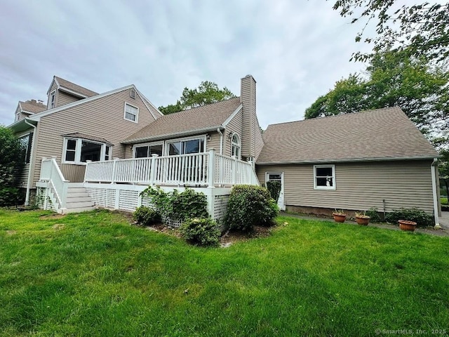 8 Breezy Knoll Ave, Wolcott, CT 06716 - back of house with a chimney, a deck, a yard, and a shingled roof