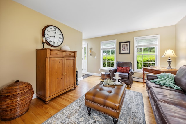 5 Goldfinch Ter, East Lyme, CT 06333 - living room with baseboard heating and light wood-type flooring