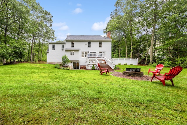 5 Goldfinch Ter, East Lyme, CT 06333 - rear view of property with a fire pit, stairs, a chimney, and a deck