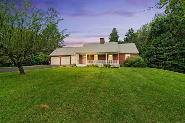 1027 Monroe Tpke, Monroe, CT 06468 - view of front of property with a porch, a chimney, driveway, an attached garage, and a yard