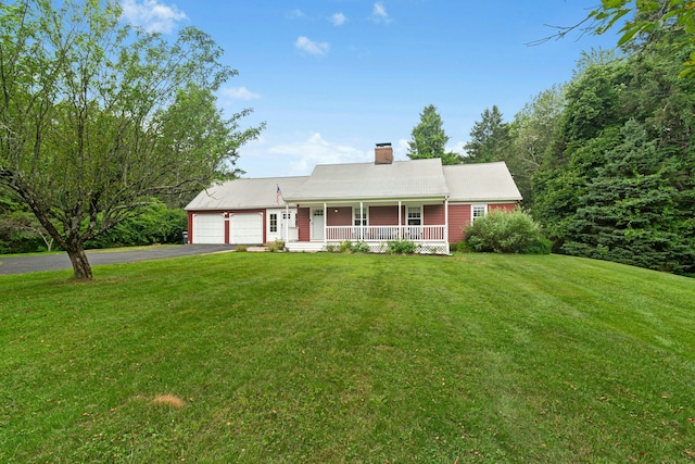 1027 Monroe Tpke, Monroe, CT 06468 - view of front facade featuring covered porch, driveway, a garage, a chimney, and a front lawn