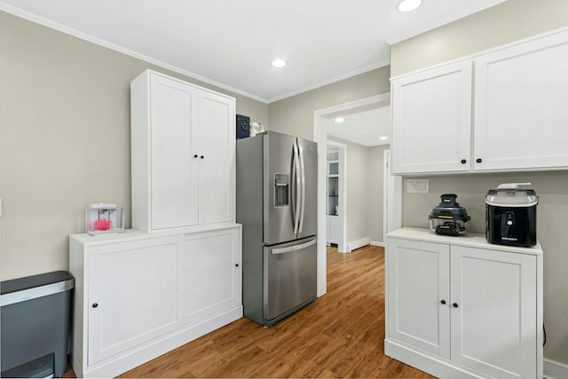 1027 Monroe Tpke, Monroe, CT 06468 - kitchen featuring stainless steel fridge, white cabinets, wood finished floors, crown molding, and recessed lighting