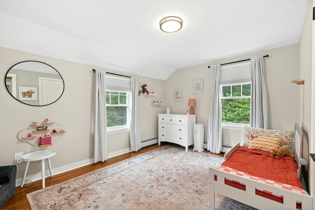 1027 Monroe Tpke, Monroe, CT 06468 - bedroom featuring wood finished floors, lofted ceiling, and baseboard heating
