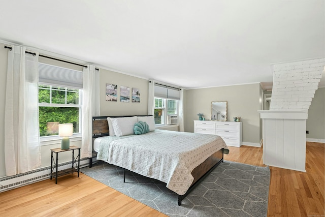 1027 Monroe Tpke, Monroe, CT 06468 - bedroom featuring wood finished floors, a baseboard heating unit, crown molding, and cooling unit