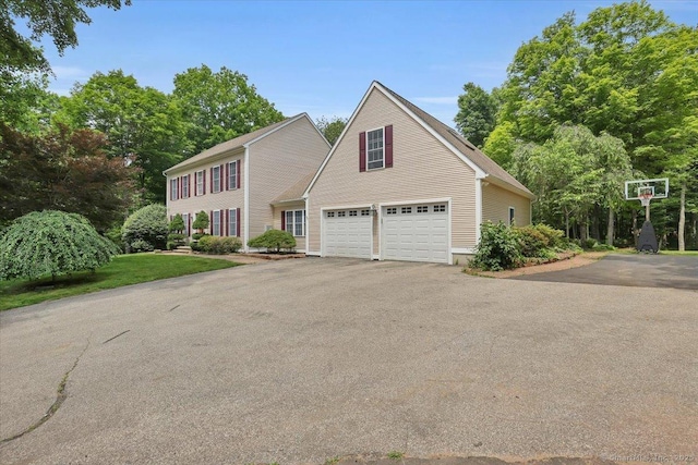 97 Cherry Swamp Rd, East Haddam, CT 06469 - colonial home featuring asphalt driveway and an attached garage