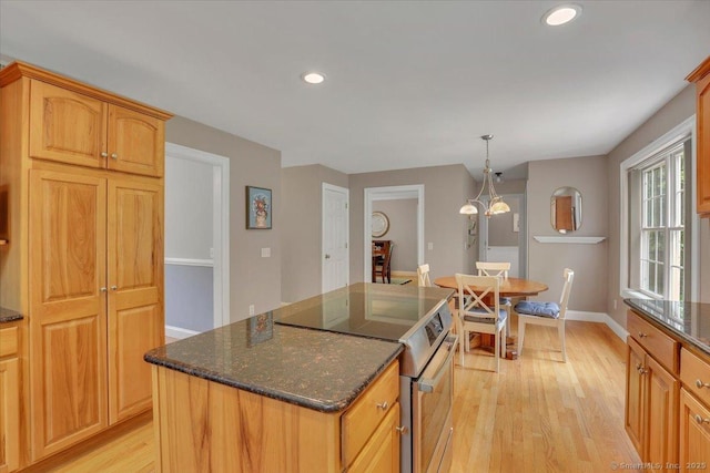 97 Cherry Swamp Rd, East Haddam, CT 06469 - kitchen with stainless steel electric range oven, light wood finished floors, dark stone counters, recessed lighting, and a center island