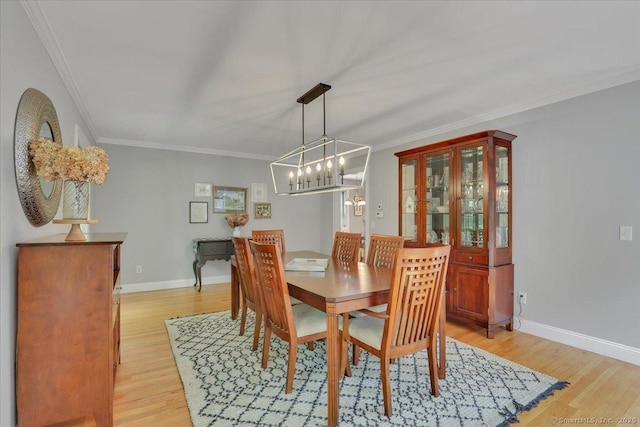97 Cherry Swamp Rd, East Haddam, CT 06469 - dining area with a chandelier, light wood-type flooring, and crown molding