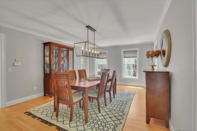 97 Cherry Swamp Rd, East Haddam, CT 06469 - dining room featuring crown molding, light wood-type flooring, and a chandelier