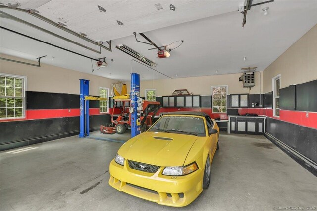 97 Cherry Swamp Rd, East Haddam, CT 06469 - garage featuring a garage door opener