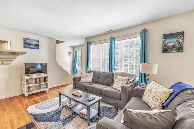 663 W Ave Unit A24, Milford, CT 06461 - living room with light wood-style flooring and baseboards