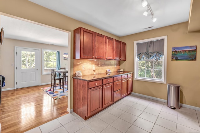 663 W Ave Unit A24, Milford, CT 06461 - kitchen featuring decorative backsplash, light wood finished floors, and rail lighting