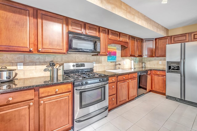 663 W Ave Unit A24, Milford, CT 06461 - kitchen with black appliances, tasteful backsplash, and brown cabinetry