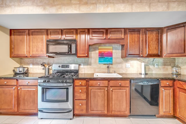 663 W Ave Unit A24, Milford, CT 06461 - kitchen with black appliances, brown cabinetry, dark stone countertops, decorative backsplash, and light tile patterned flooring