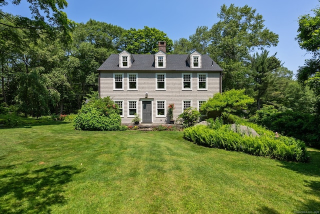 56 Turtleback Rd, Wilton, CT 06897 - view of front of house with a front yard and a chimney