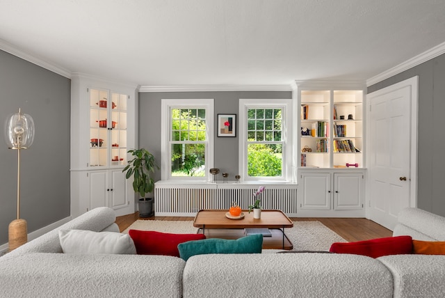 56 Turtleback Rd, Wilton, CT 06897 - living area featuring radiator, wood finished floors, and crown molding