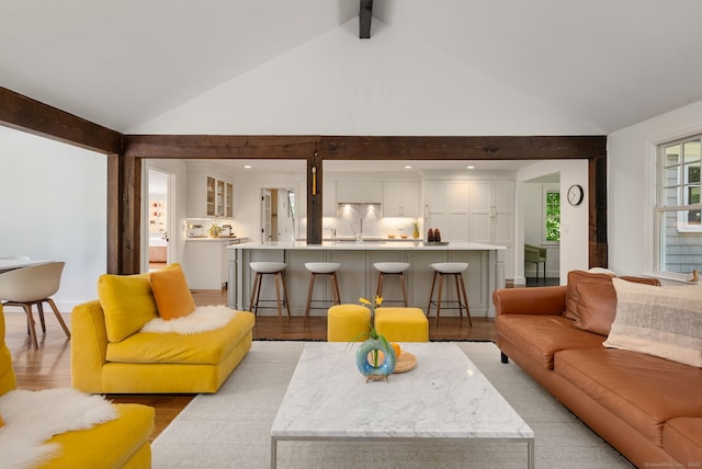 56 Turtleback Rd, Wilton, CT 06897 - living area with light wood-type flooring, beamed ceiling, and high vaulted ceiling