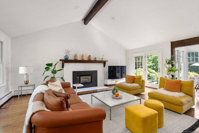 56 Turtleback Rd, Wilton, CT 06897 - living room featuring wood finished floors, plenty of natural light, and a brick fireplace
