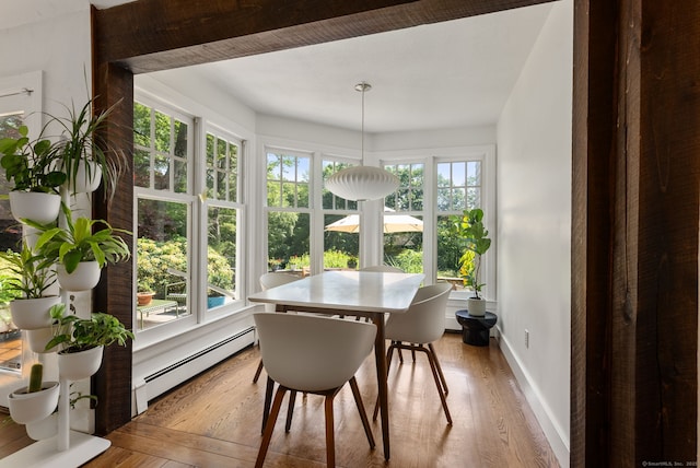 56 Turtleback Rd, Wilton, CT 06897 - dining room featuring a baseboard radiator, healthy amount of natural light, and wood finished floors