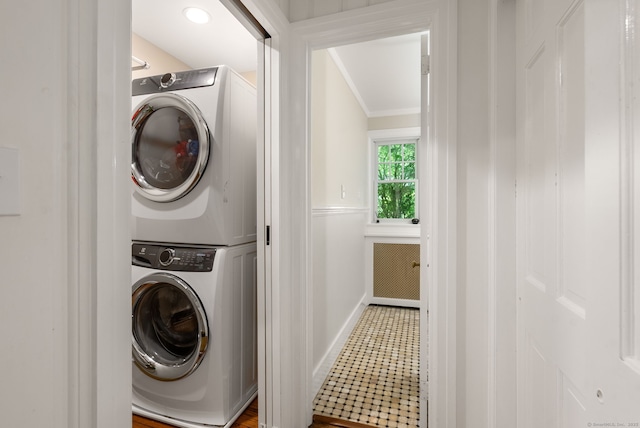 56 Turtleback Rd, Wilton, CT 06897 - washroom with stacked washing machine and dryer and crown molding