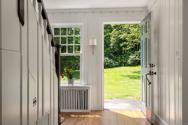 56 Turtleback Rd, Wilton, CT 06897 - doorway featuring radiator heating unit and light wood-type flooring
