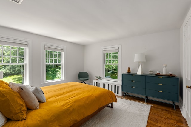 56 Turtleback Rd, Wilton, CT 06897 - bedroom featuring radiator heating unit and dark wood-style floors
