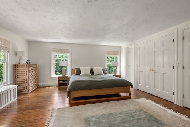 56 Turtleback Rd, Wilton, CT 06897 - bedroom featuring a textured ceiling and hardwood / wood-style flooring
